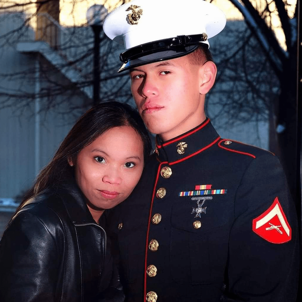 woman posing with man in marinecorps blues