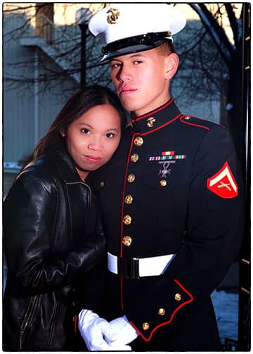 woman posing with man in marinecorps blues